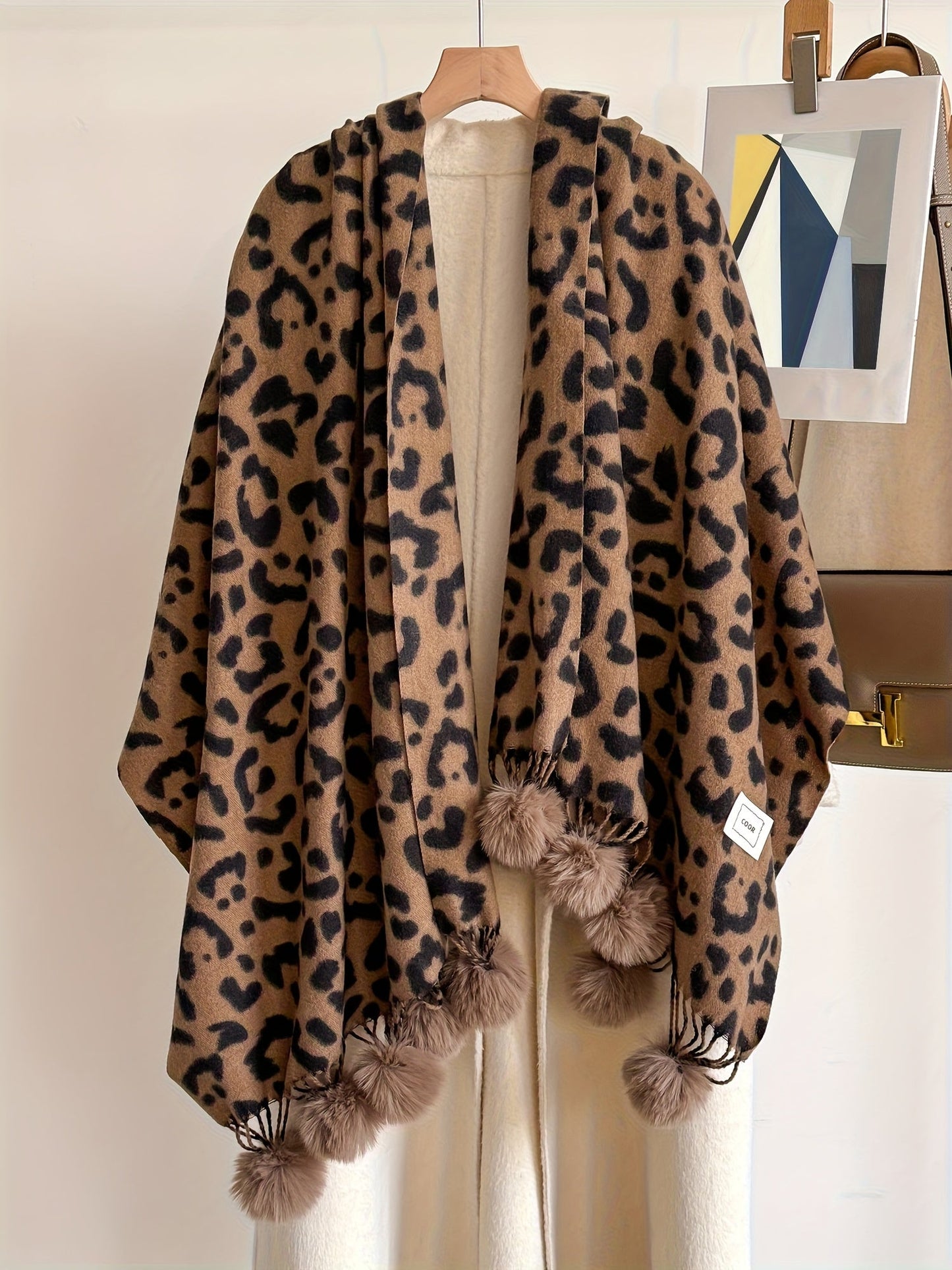 Leopard-print scarf with pom-poms