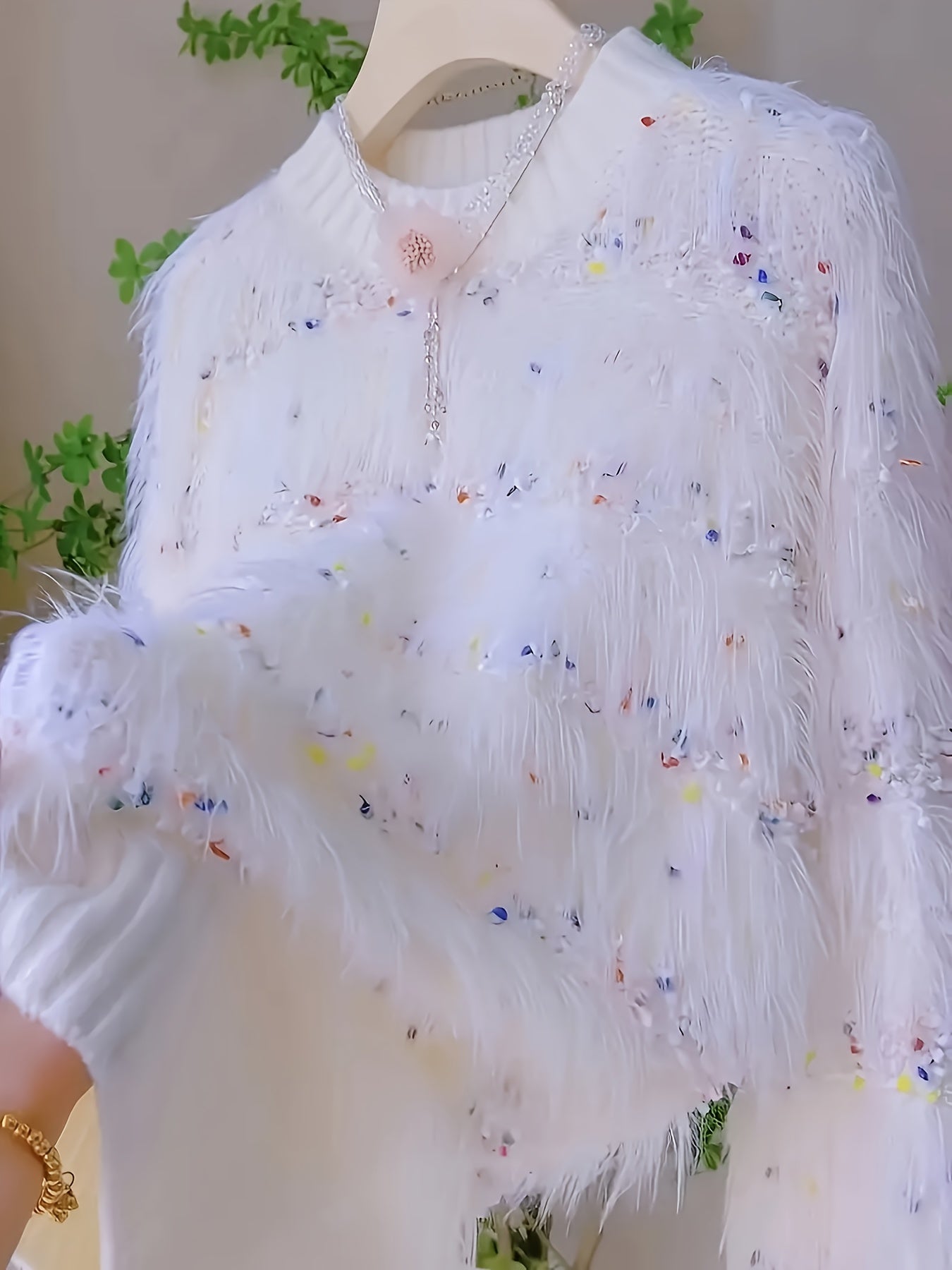 White fluffy pullover with colorful accents