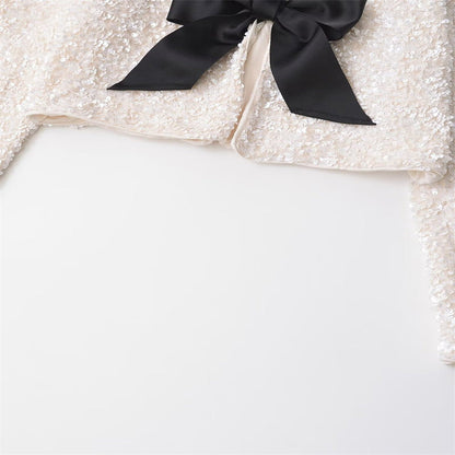 Amelia – Versatile short jacket with bow decoration and sequins