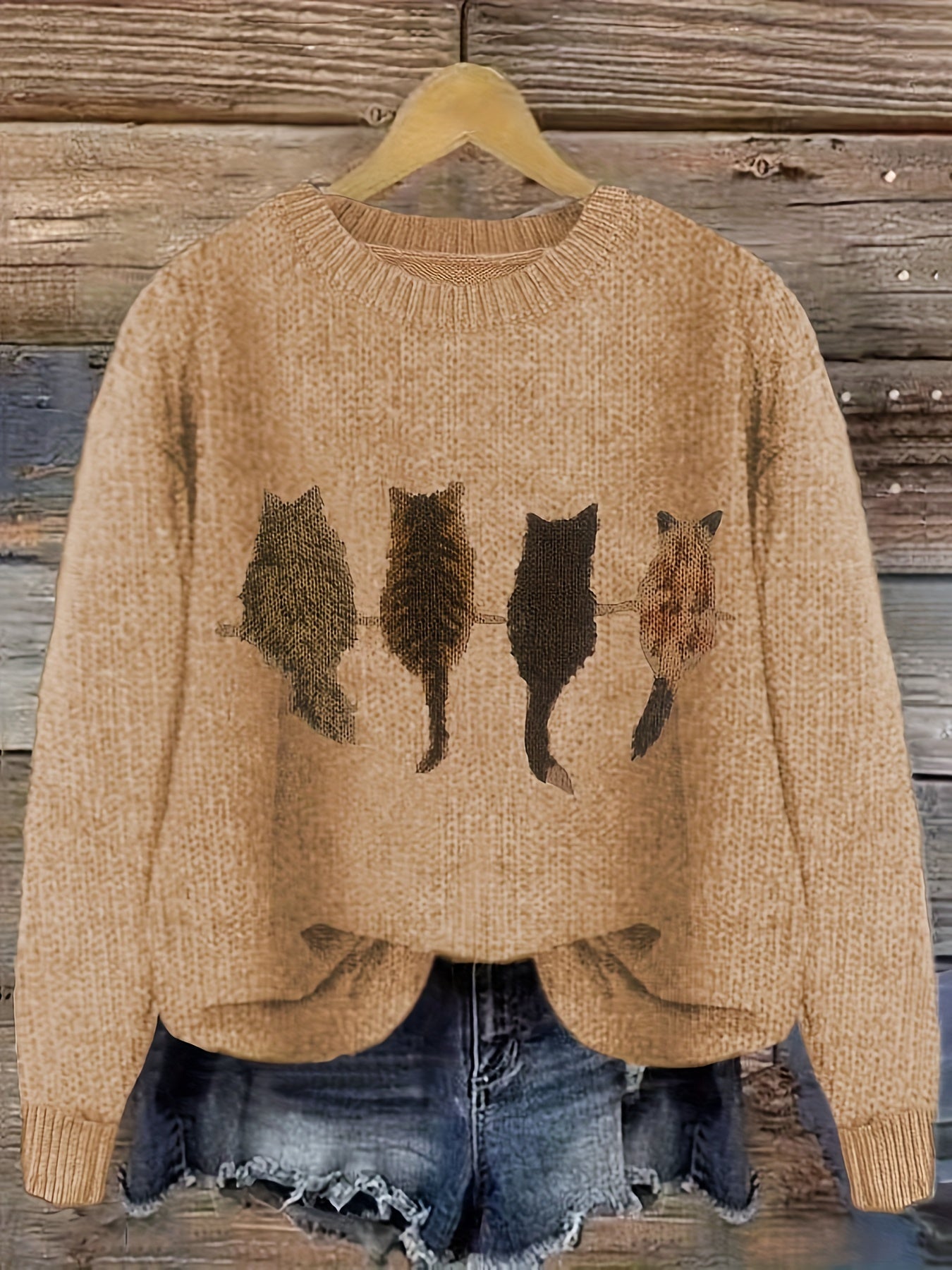 Women's knitted sweater with round neckline and cat motif