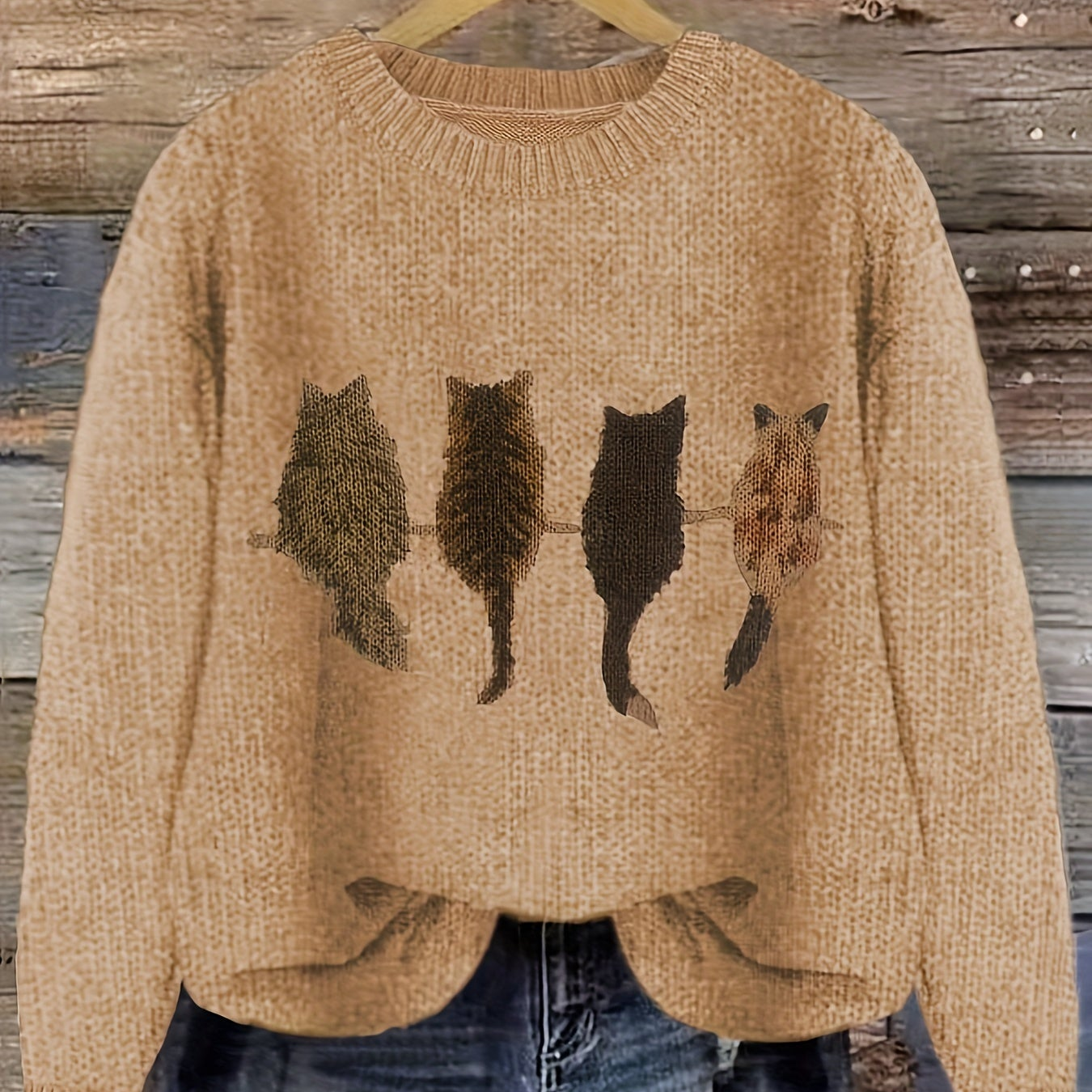 Women's knitted sweater with round neckline and cat motif