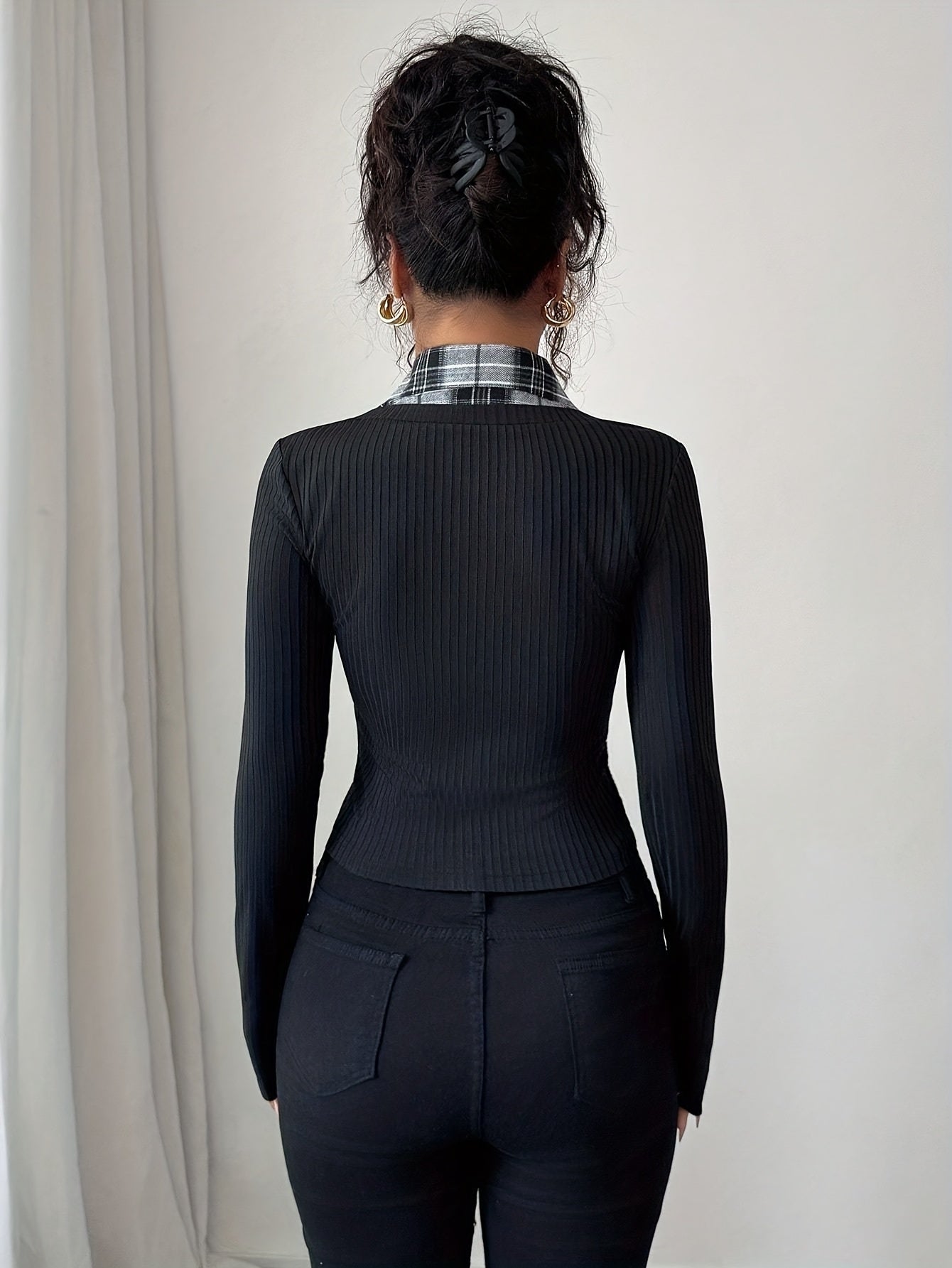 Women's black long-sleeve top with a checked blouse look