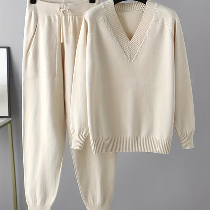 Two-piece women’s knitted set with a V-neck sweater and jogger pants in a beige ribbed-knit design