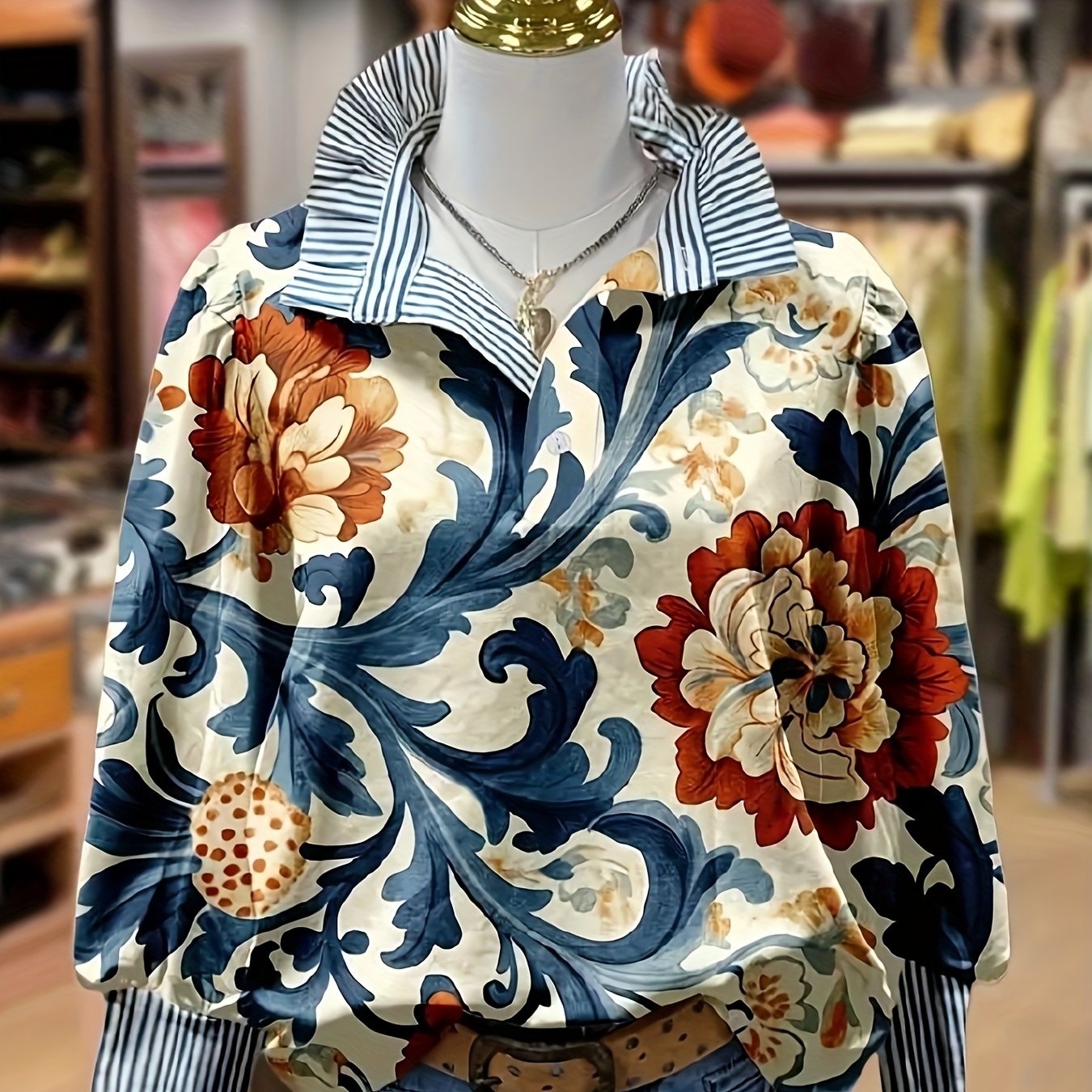 Women's blouse with a floral pattern, striped collar and cuffs, long sleeves