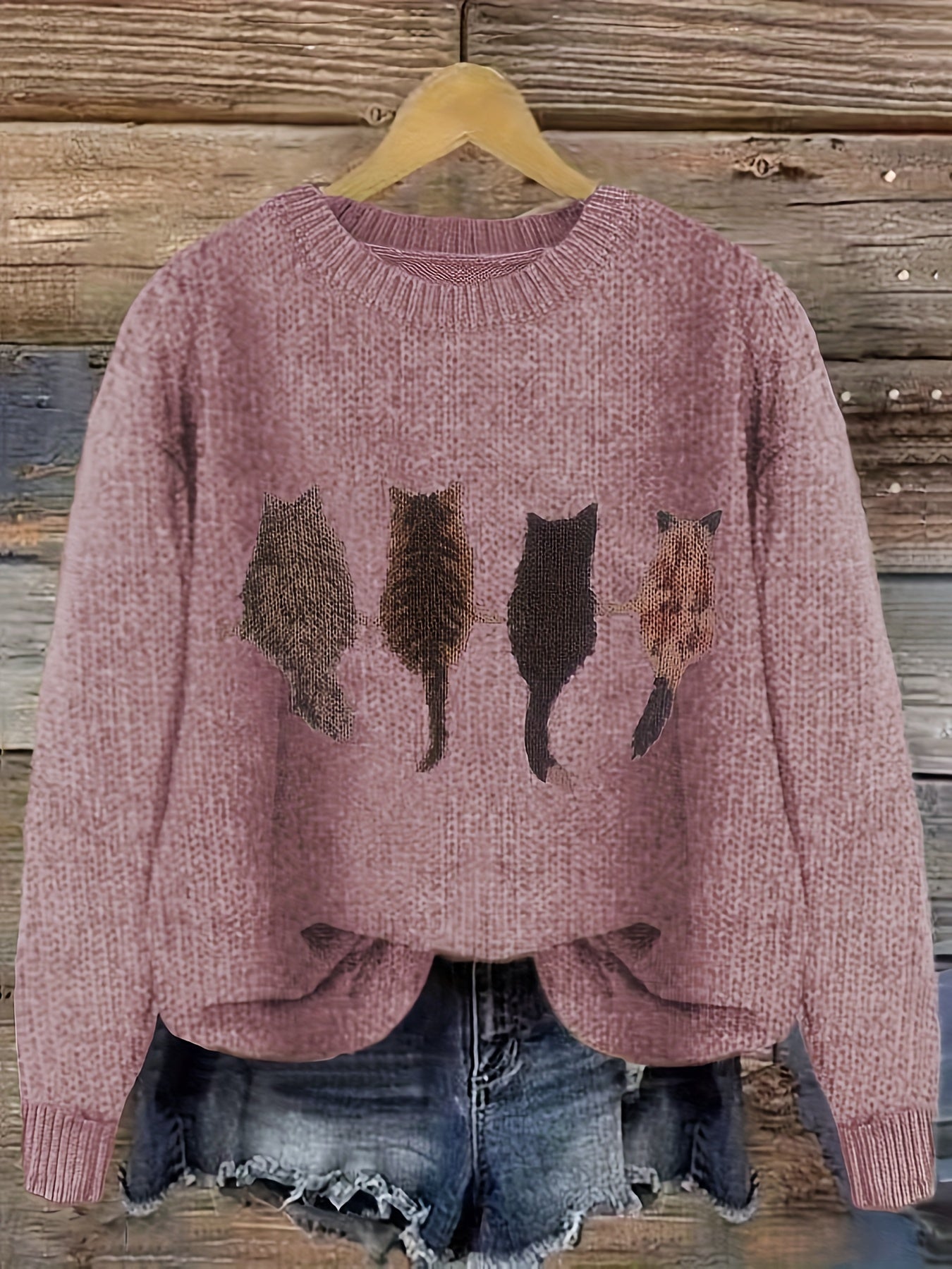 Women's knitted sweater with round neckline and cat motif