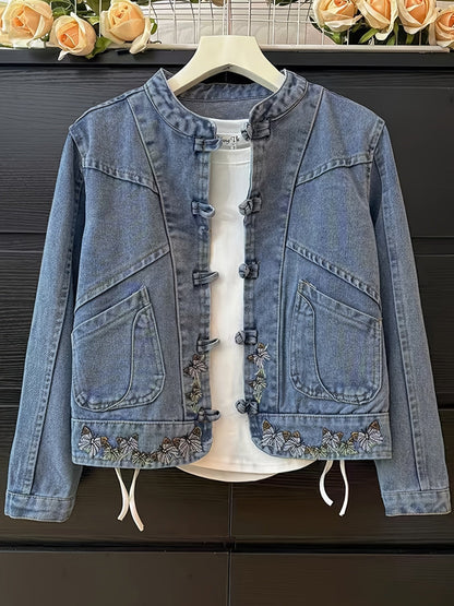 Women's denim jacket with stand-up collar, frog closures, and embroidery