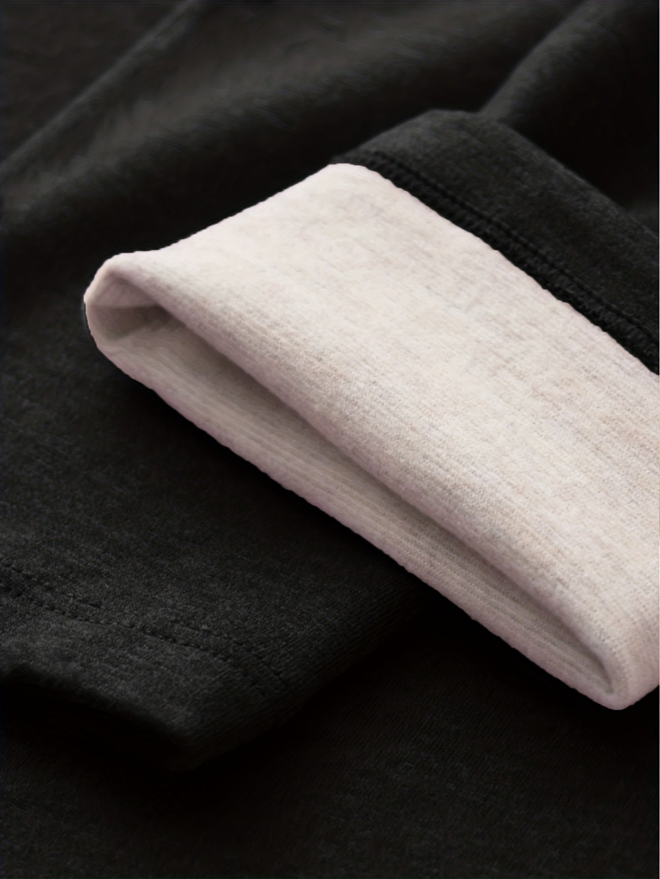 Women's black high-waisted leggings with a thermal look, opaque