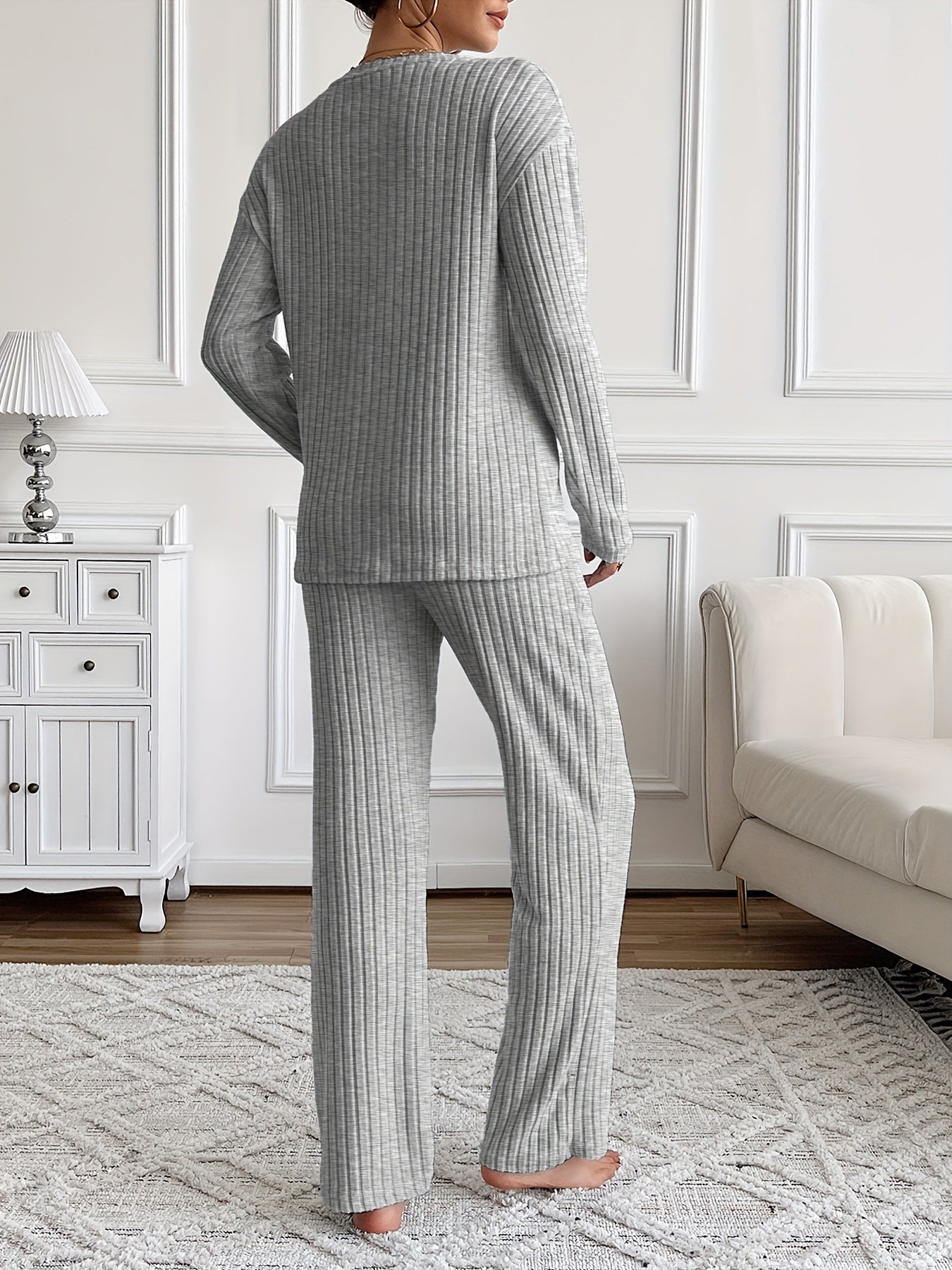 Ribbed women’s two-piece set with a V-neck top featuring lettering and wide-leg pants