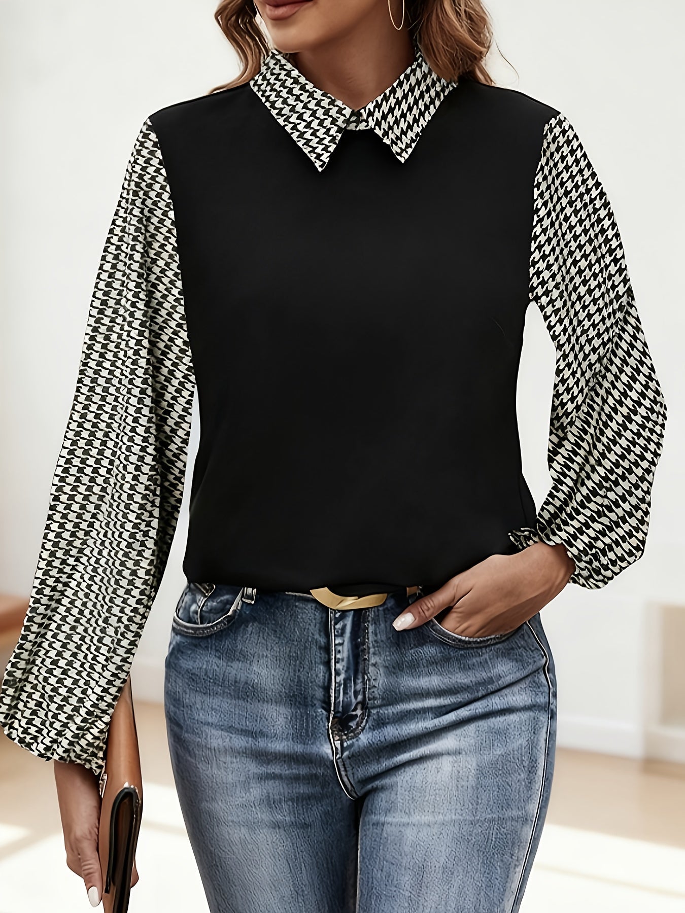 Women's black blouse with houndstooth-patterned sleeves and collar