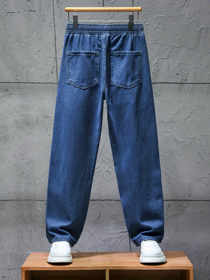 Dark blue jeans with an elastic waistband and drawstring