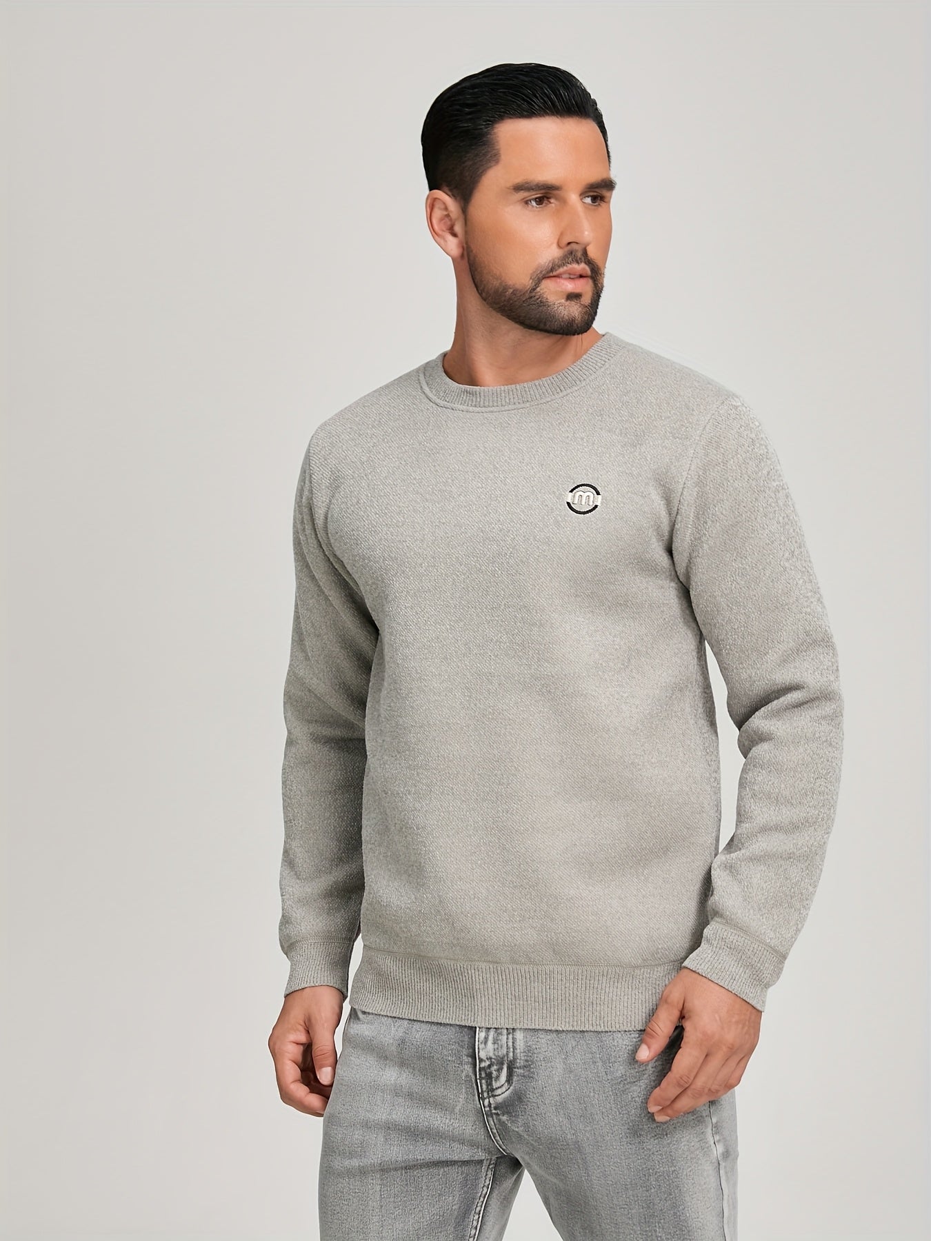 Unisex long-sleeve pullover with a crew neck and ribbed cuffs, lined