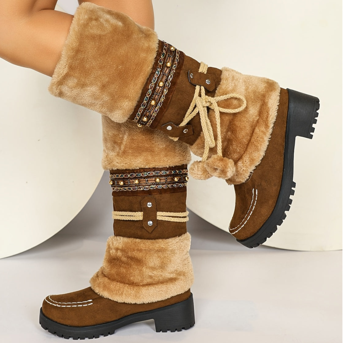 Women's brown winter boots with faux fur, decorative straps & pom-poms