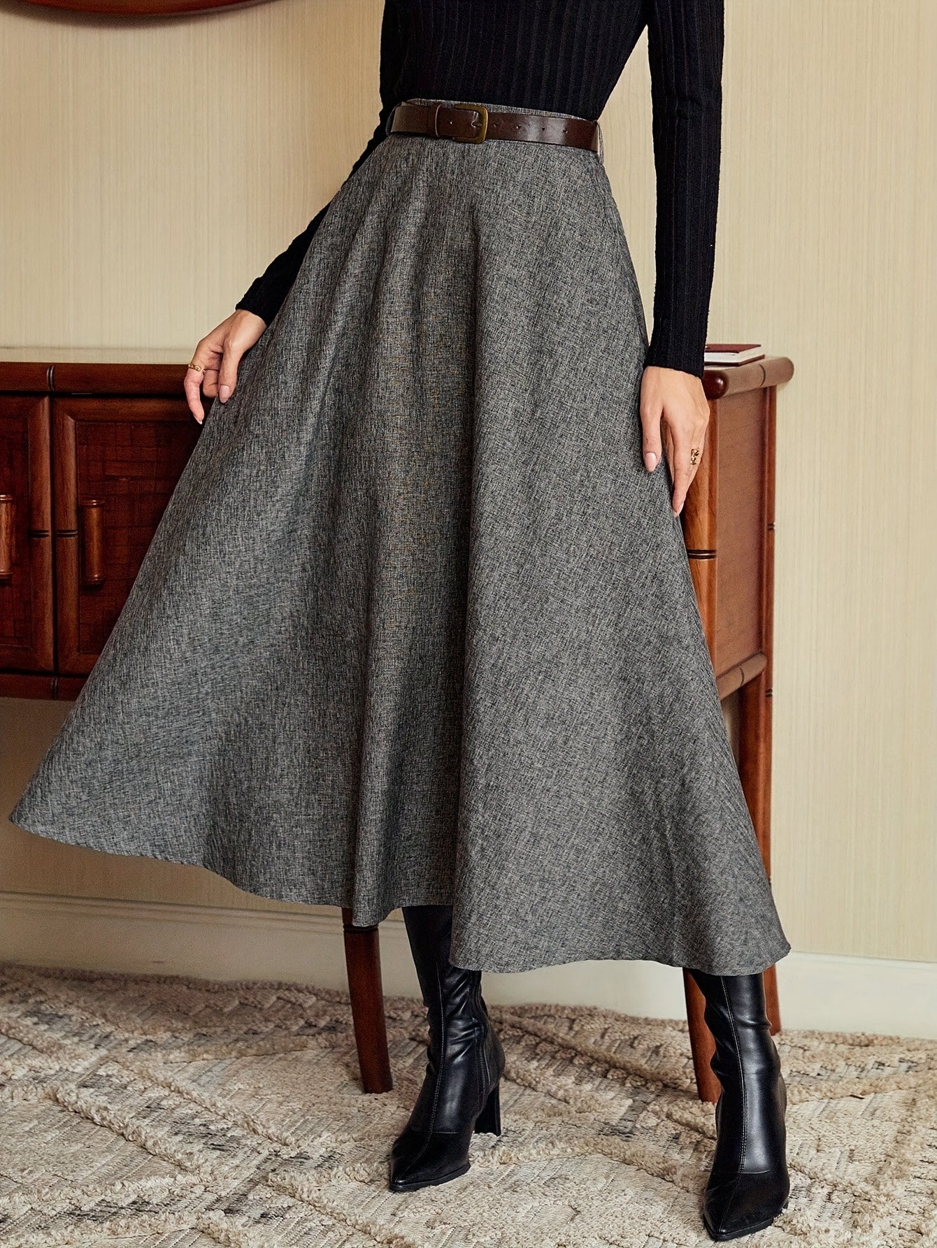 Women's gray A-line midi skirt with a flared hem