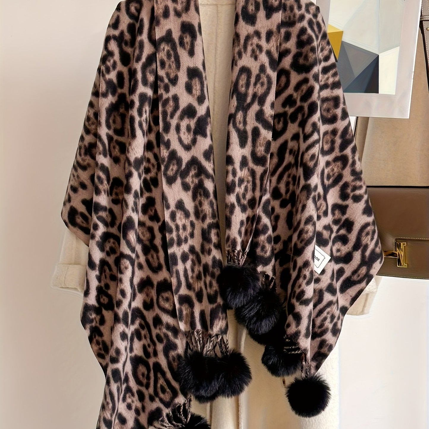 Leopard-print scarf with pom-poms