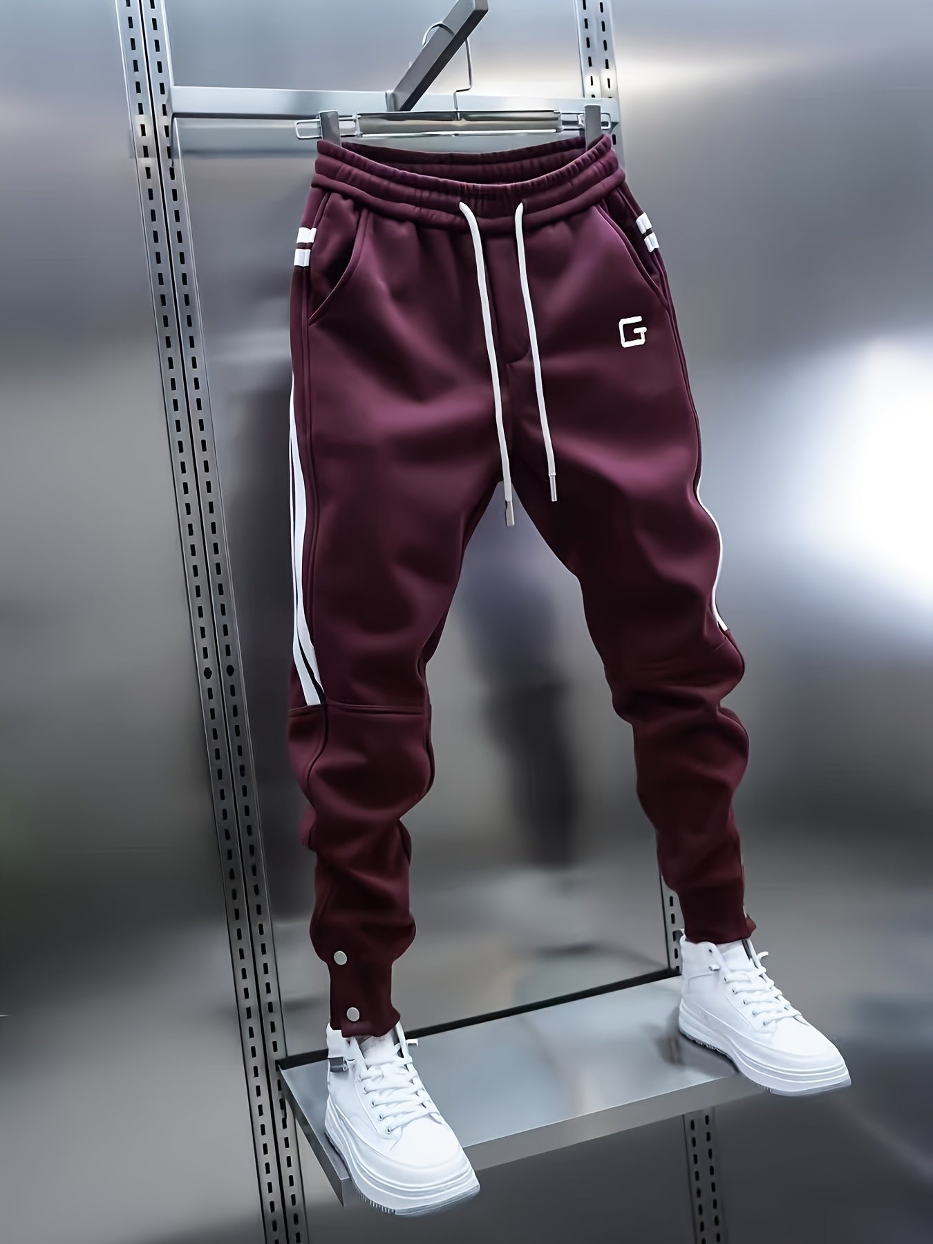 Men's sporty joggers with drawstring, stripes, and buttons