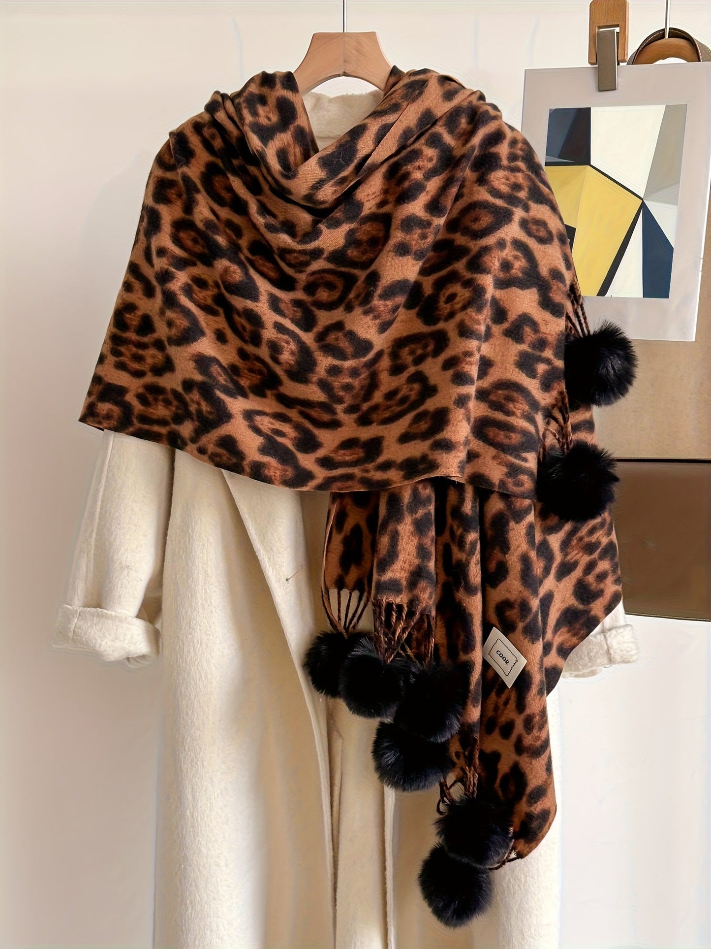 Leopard-print scarf with pom-poms