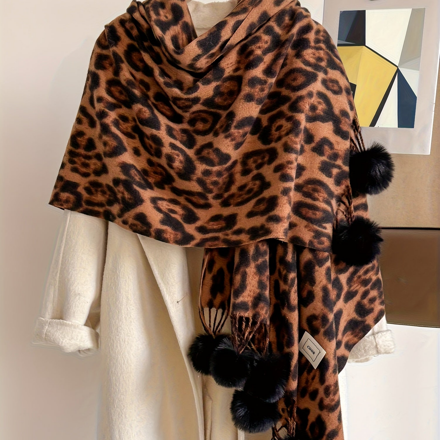 Leopard-print scarf with pom-poms