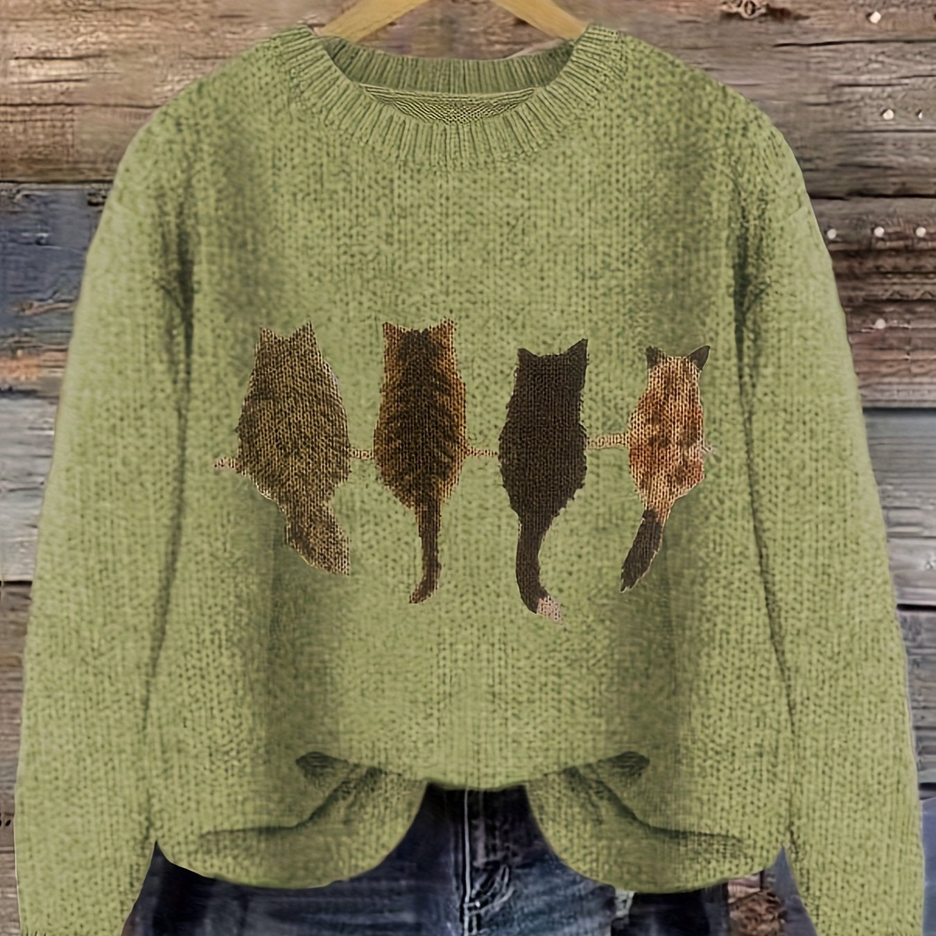 Women's knitted sweater with round neckline and cat motif