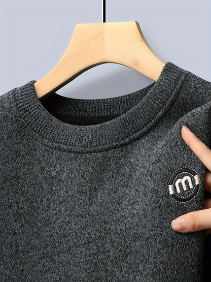 Unisex long-sleeve pullover with a crew neck and ribbed cuffs, lined