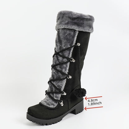 Women's black winter boots with plush trim, laces, and a zipper
