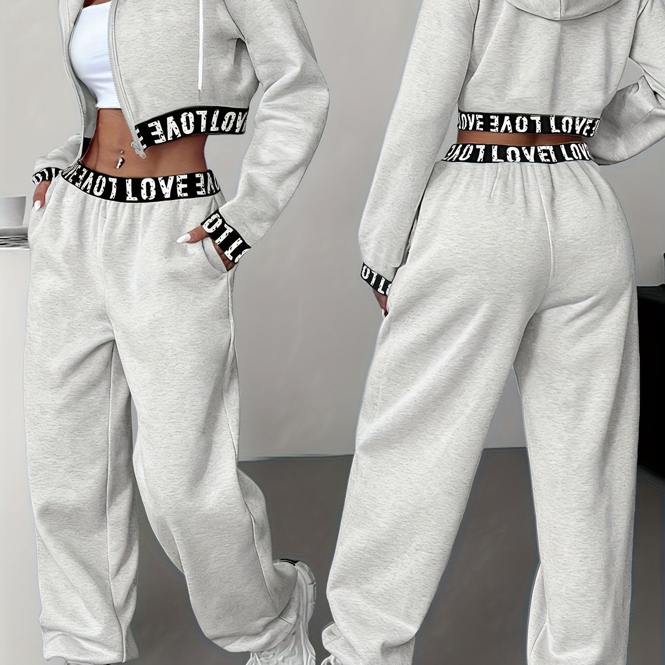Women's two-piece tracksuit with a hooded jacket and cropped-length joggers featuring a “LOVE” waistband