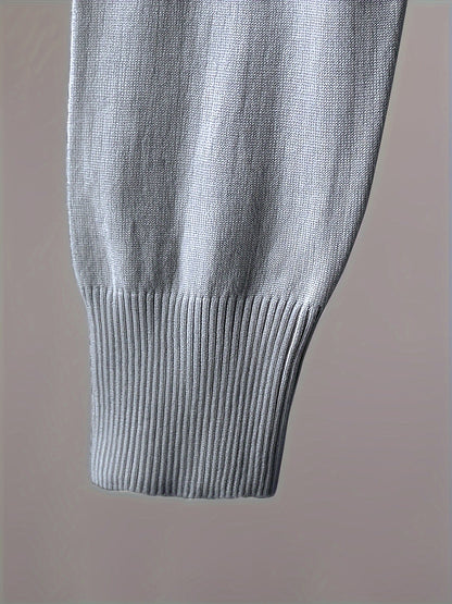 Two-piece women’s knitted set with a V-neck sweater and jogger pants in a beige ribbed-knit design