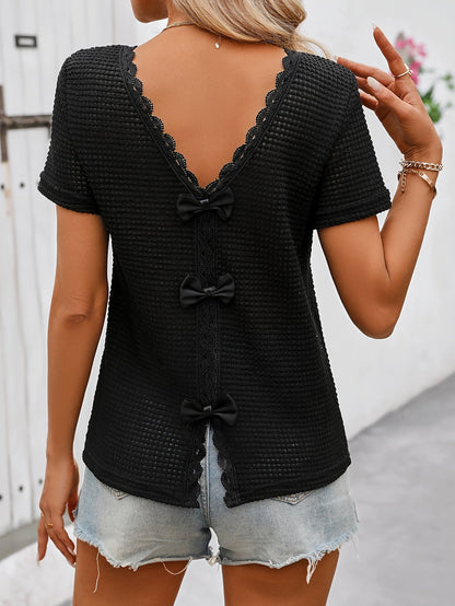 Women's short-sleeve top with lace back cutout and bow – feminine style for casual wear and summer