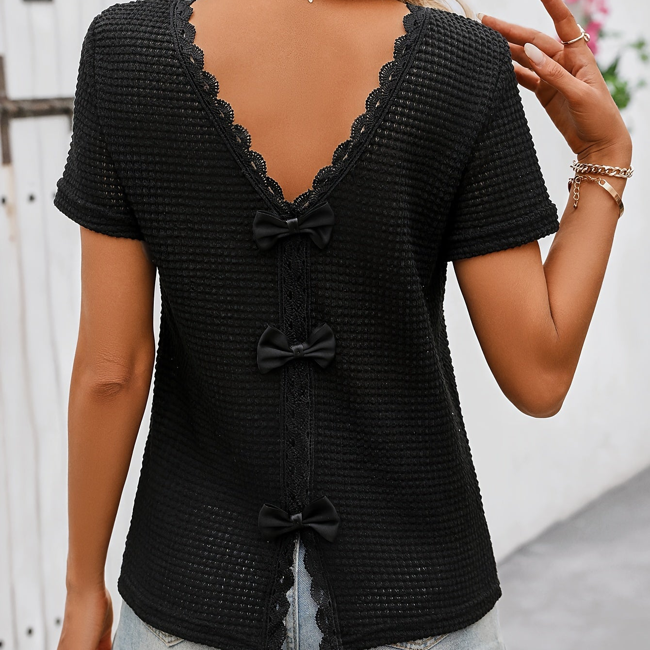 Women's short-sleeve top with lace back cutout and bow – feminine style for casual wear and summer