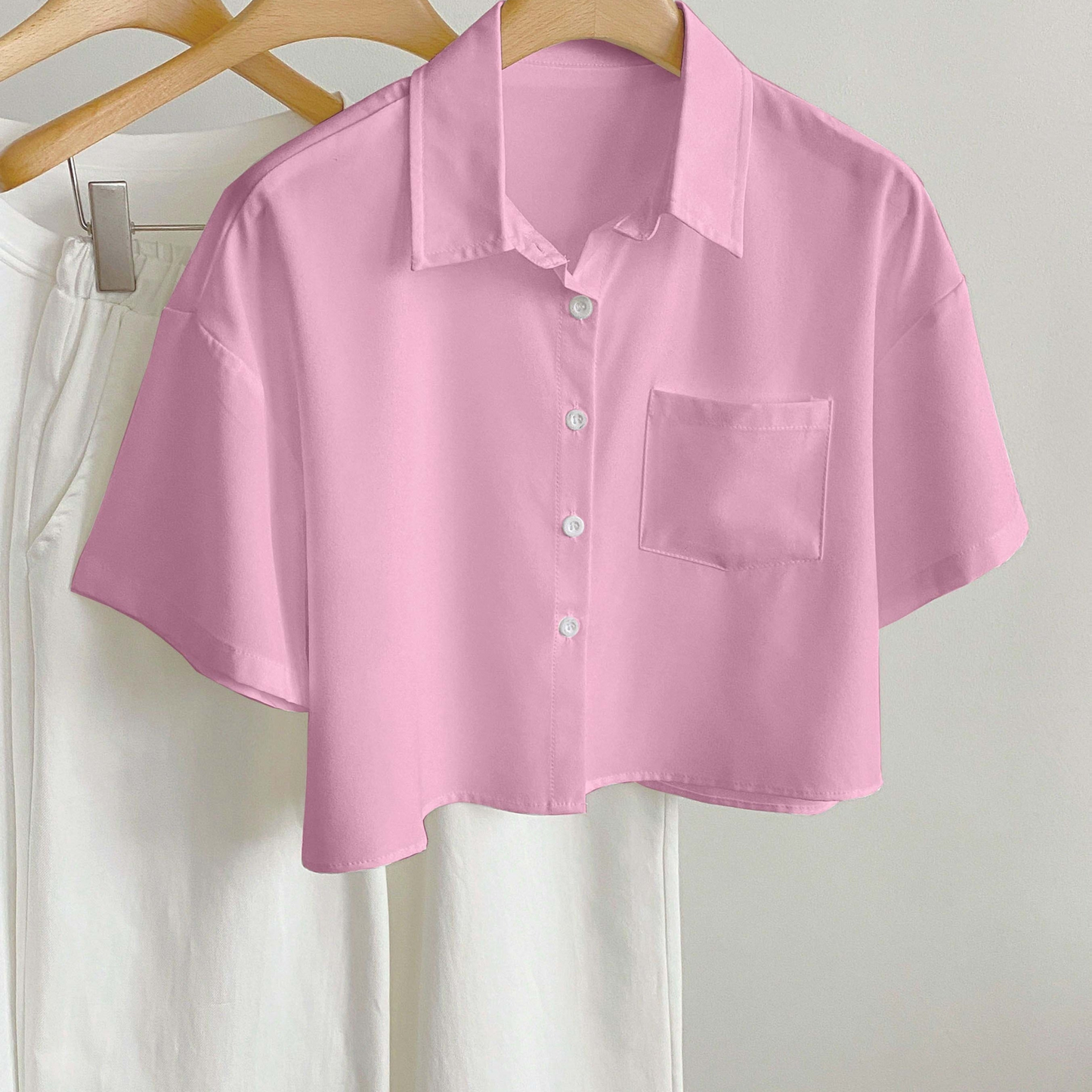 Women's short-sleeve blouse with crop cut and chest pocket – modern casual shirt