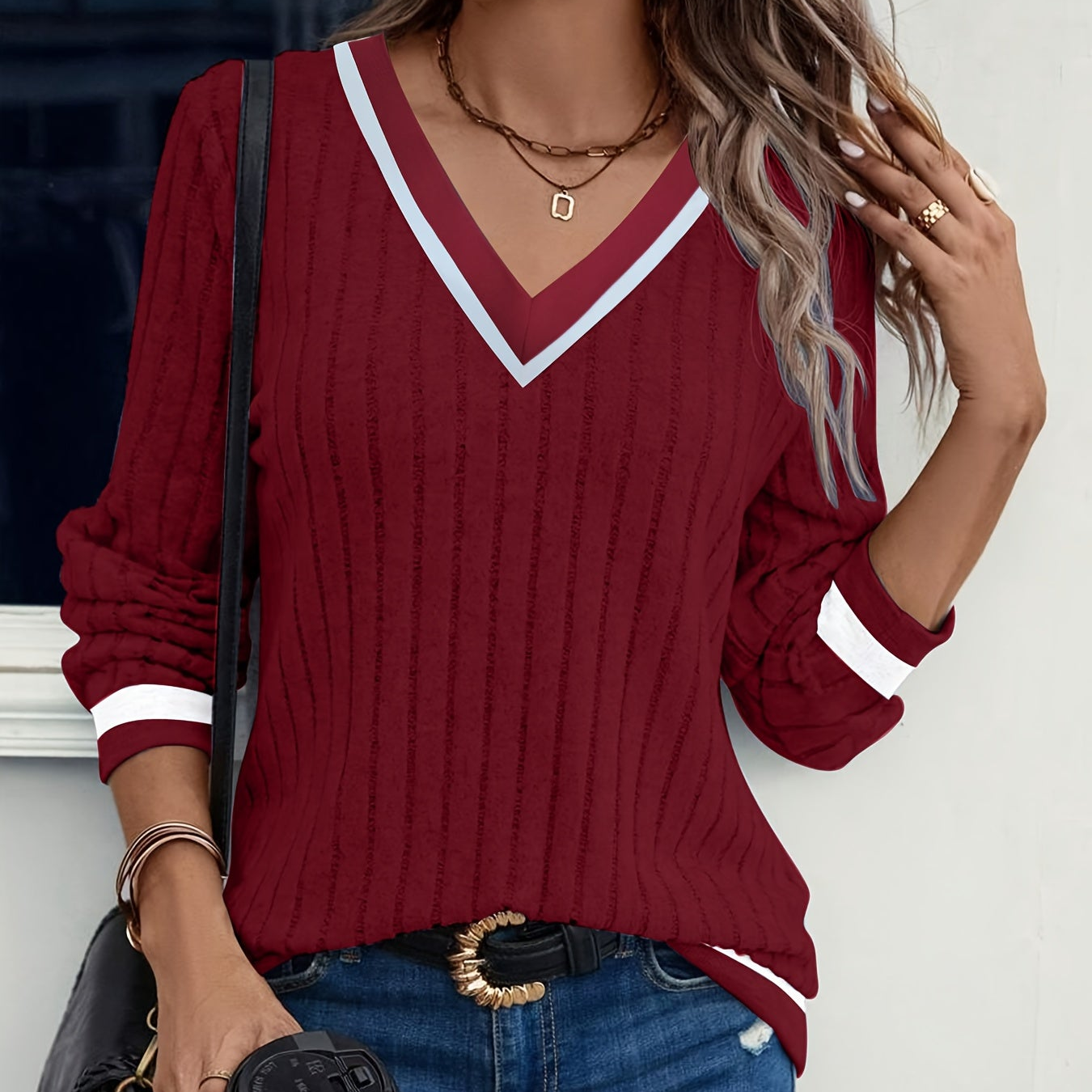 Women's V-neck knitted sweater with striped details, long sleeves, ribbed texture
