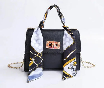 Elegant women's handbag with scarf handle and chain strap – fashionable accessory for everyday use and events