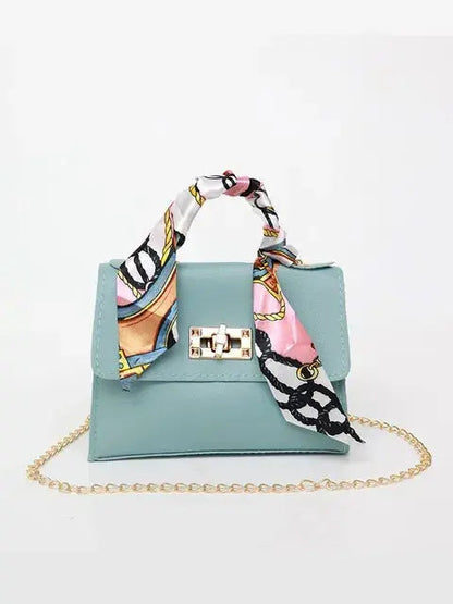 Elegant women's handbag with scarf handle and chain strap – fashionable accessory for everyday use and events